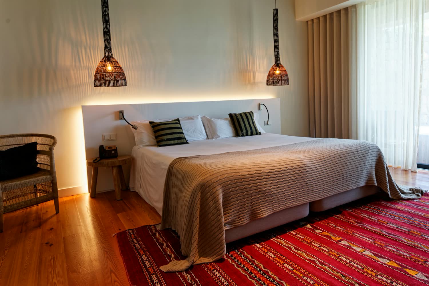 A Garden room with warm lighting and a king bed