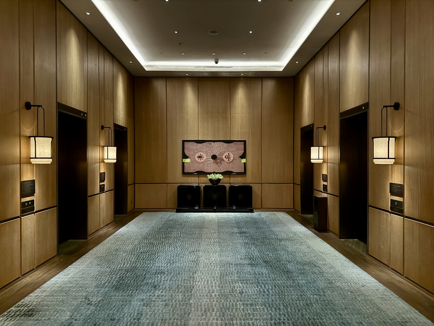 The panelled corridor at The Alder, lit low