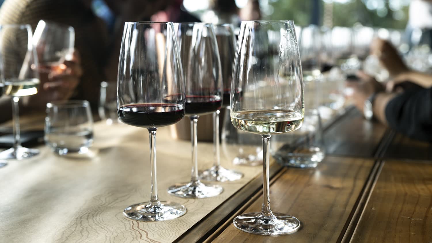 Wine glasses set on a table before service