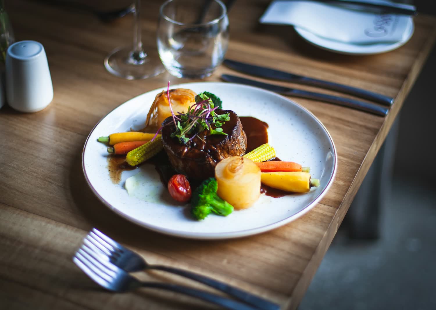 Slow cooked meat with roasted root vegetables