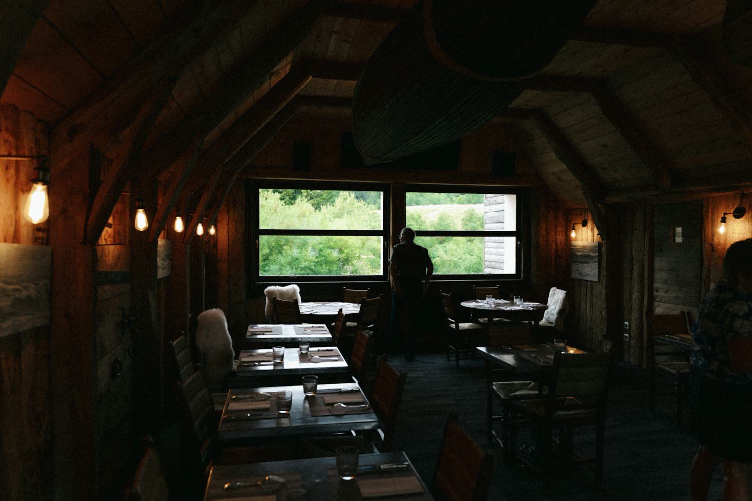 Tables laid in the dining room by the windows