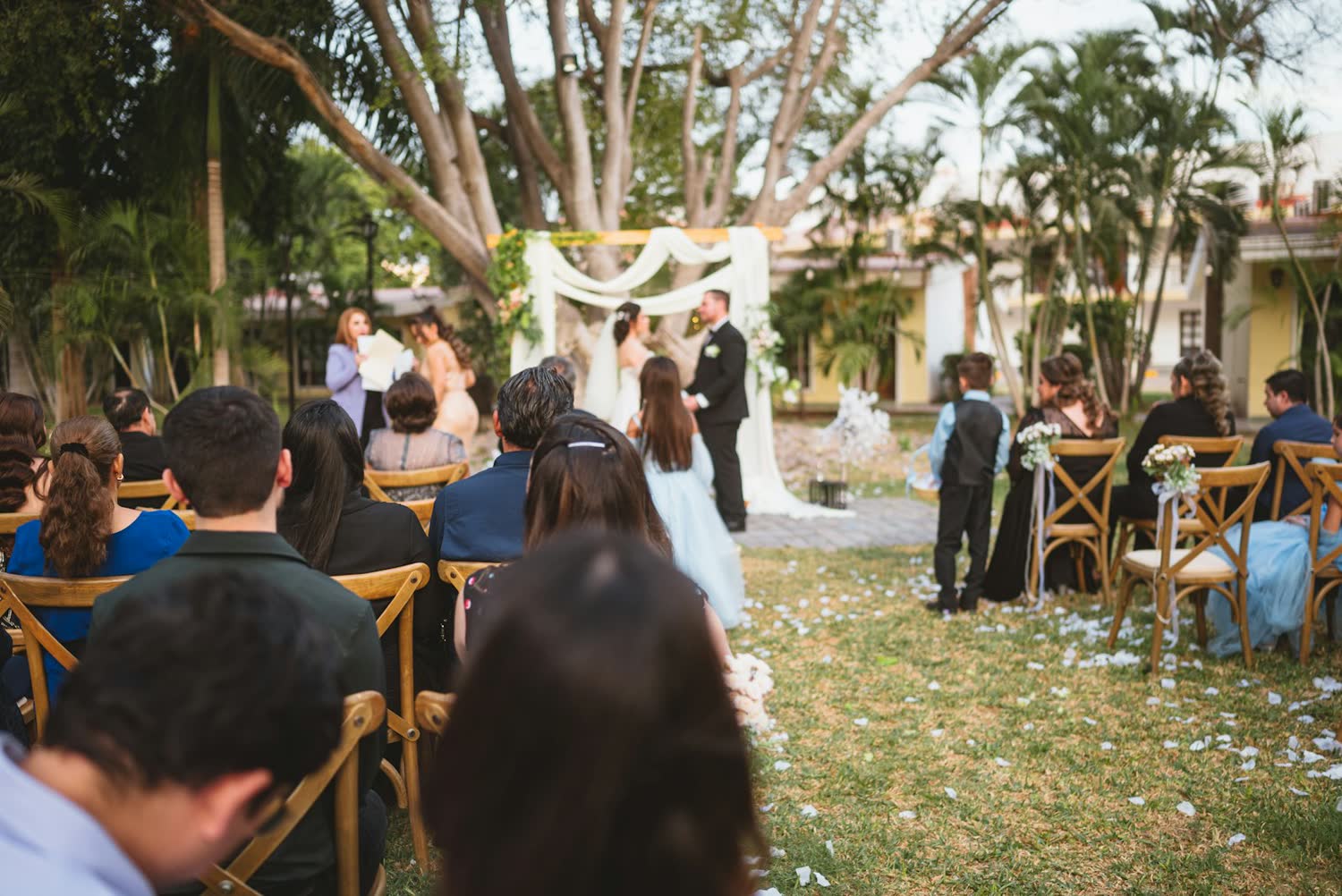 Guests seated for an outdoor ceremony